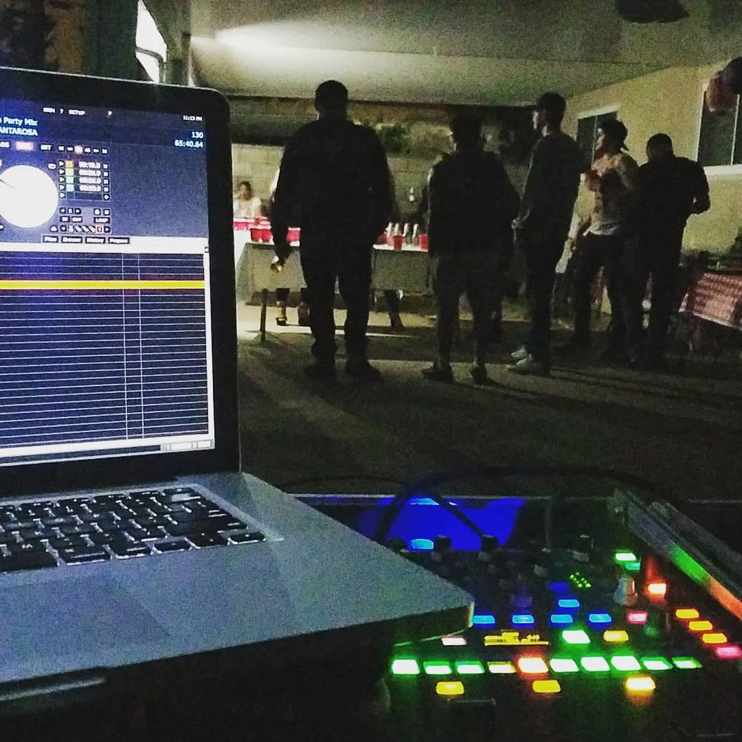 Night-time outdoor party lit by the glow of the controller
