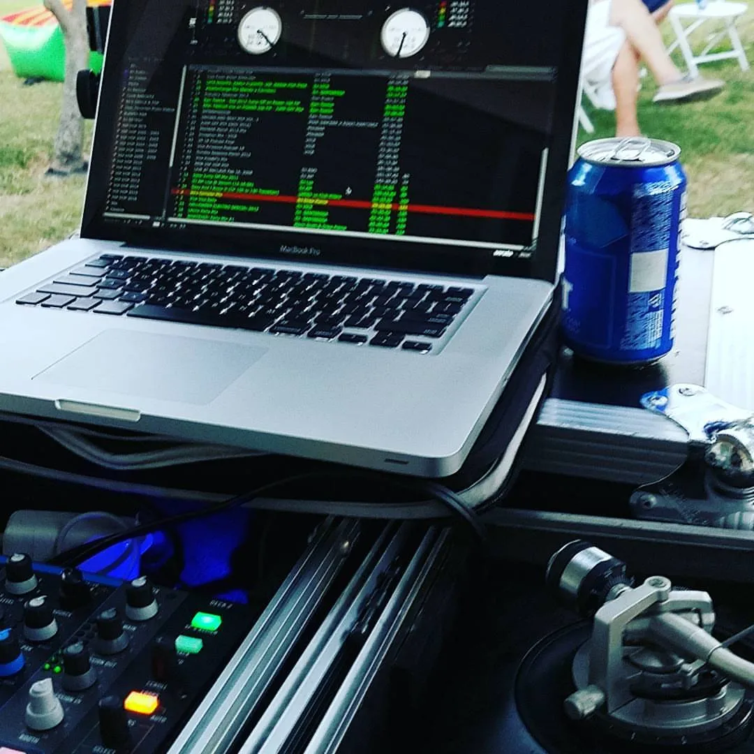 Laptop and controller set up for an outdoor afternoon party
