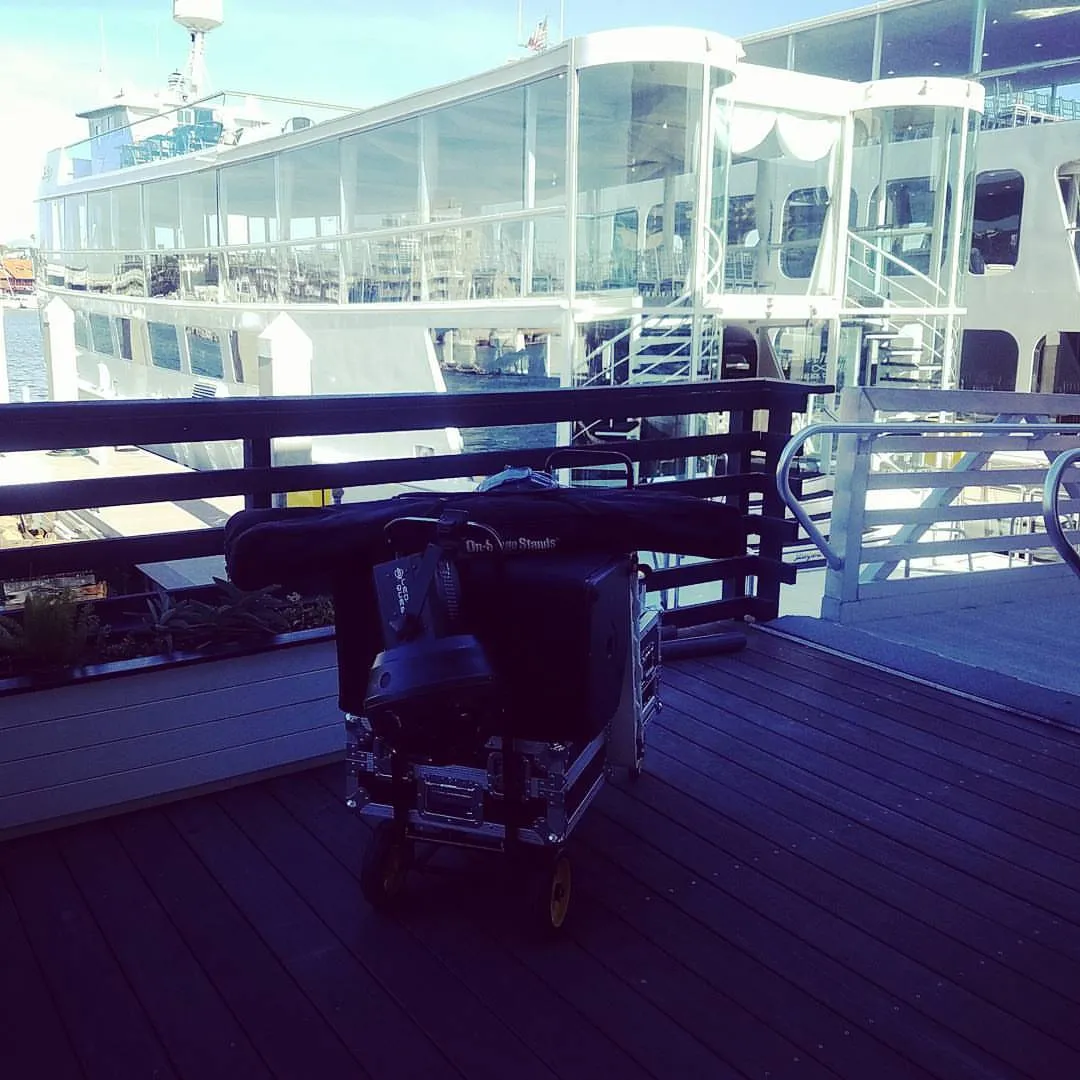 DJ gear cart rolled onto a yacht deck before a charter event